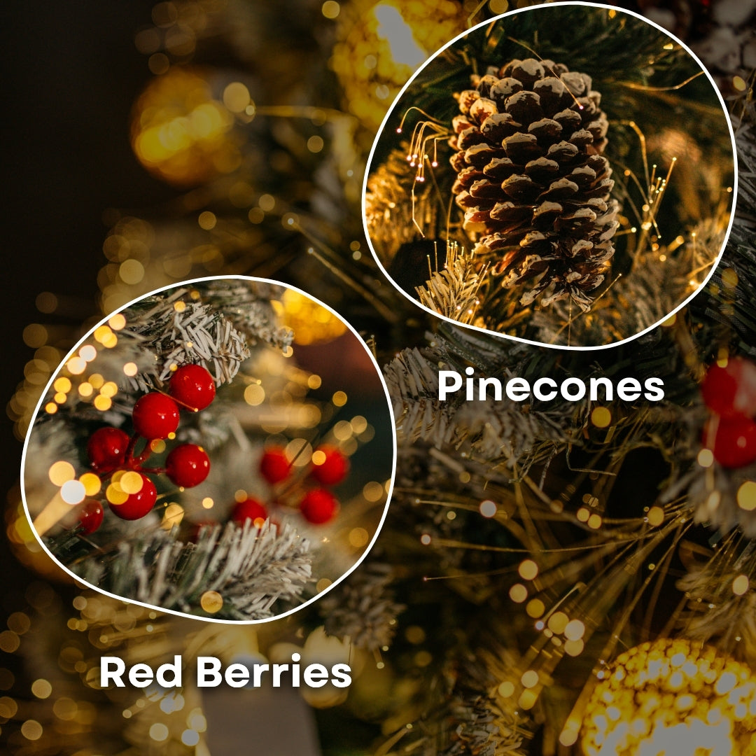 Close-up of frosted pinecone and red berry clusters nestled among the branches of a prelit Christmas tree