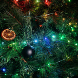 Closeup of 10m colourful LED fairy lights on a green wire on the Christmas Tree
