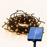 Solar Fairy Lights and their Solar Panel on an off-white background.
