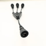 Closeup of the cable connection point linking the 3-way connector to the main string light plug