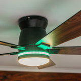 Close-up of 52 inch black wood smart LED ceiling fan showing walnut wood blade grain detail and matte black motor body from below