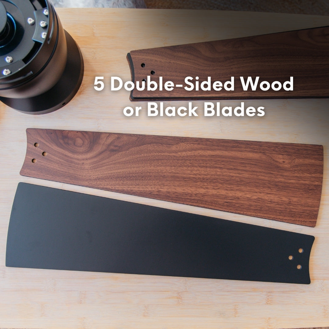 Close-up of 52 inch smart ceiling fan reversible blades showing walnut wood grain finish on one side and matte black finish on the other