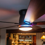 Close-up of 52 inch smart LED ceiling fan showing RGB ambient light ring glowing in colour mode in a modern lounge setting