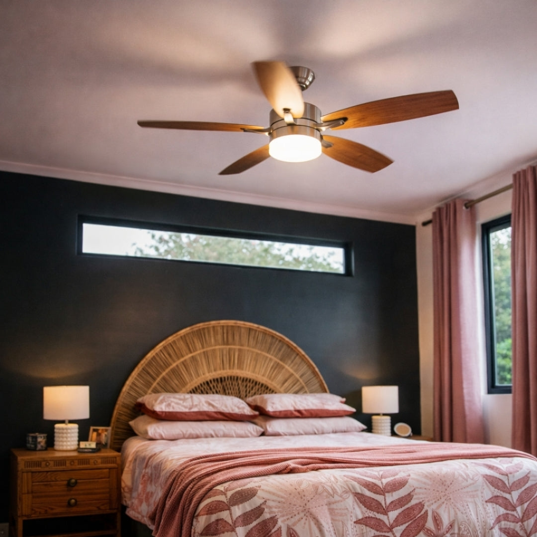 52 inch brushed silver oak blade ceiling fan installed in a modern South African bedroom with warm white light glowing and five reversible oak blades creating a refined contemporary look