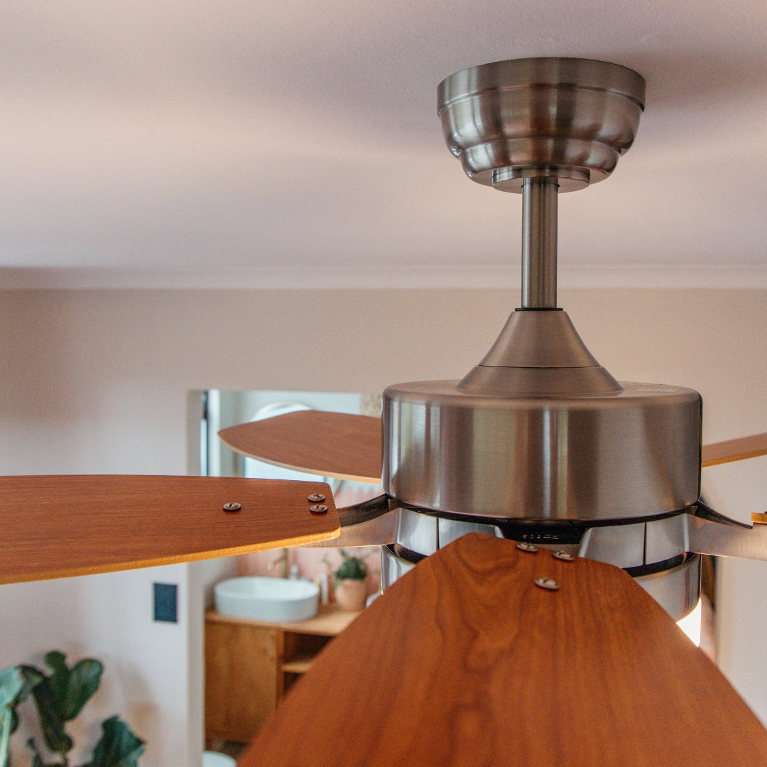 Close-up of 52 inch brushed silver oak blade ceiling fan downrod and brushed silver motor housing connection detail showing installation fitting