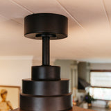 Close-up of 52 inch dark oak wood blade ceiling fan downrod and motor housing connection detail showing installation fitting