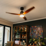 52 inch dark oak wood blade ceiling fan installed on ceiling with motor running, three real oak wood blades spinning, and integrated LED light glowing warm white