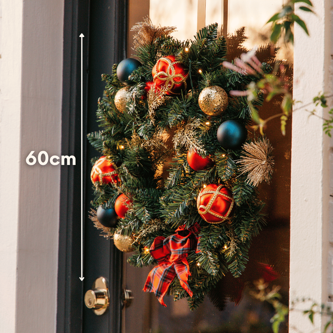 Christmas wreath on a door with 60cm size measurement shown