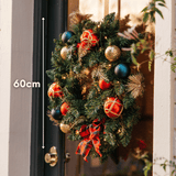 Christmas wreath on a door with 60cm size measurement shown