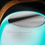 Bluetooth Speaker Lantern on outdoor table with Bluetooth 5.0 and 10m range callout showing wireless music streaming from a smartphone