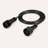 A 2m extension kit laid out on a light beige background, including a spool of 2m black cable.