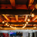 Classic String Lights Pro strung across a wooden beam ceiling at the East Coast Radio House and Garden Show display