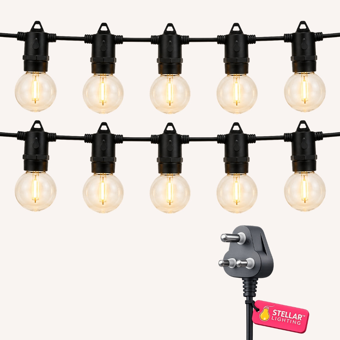 Classic String Lights Pro flat lay showing two rows of warm white G40 globe bulbs on black cable with South African plug on a light background
