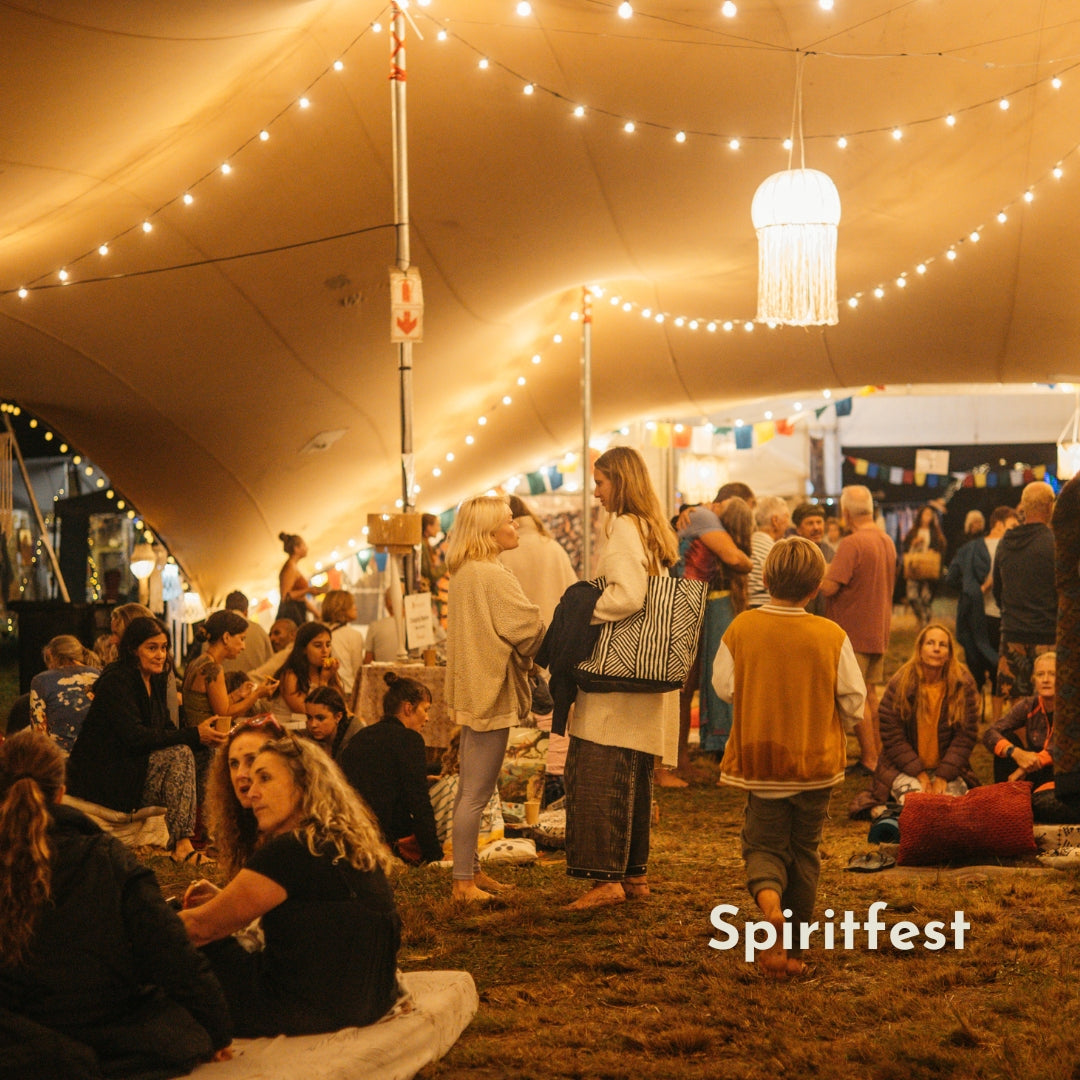 Classic String Lights with 25 warm white G40 globe bulbs strung across Spiritfest creating a warm continuous golden glow at night