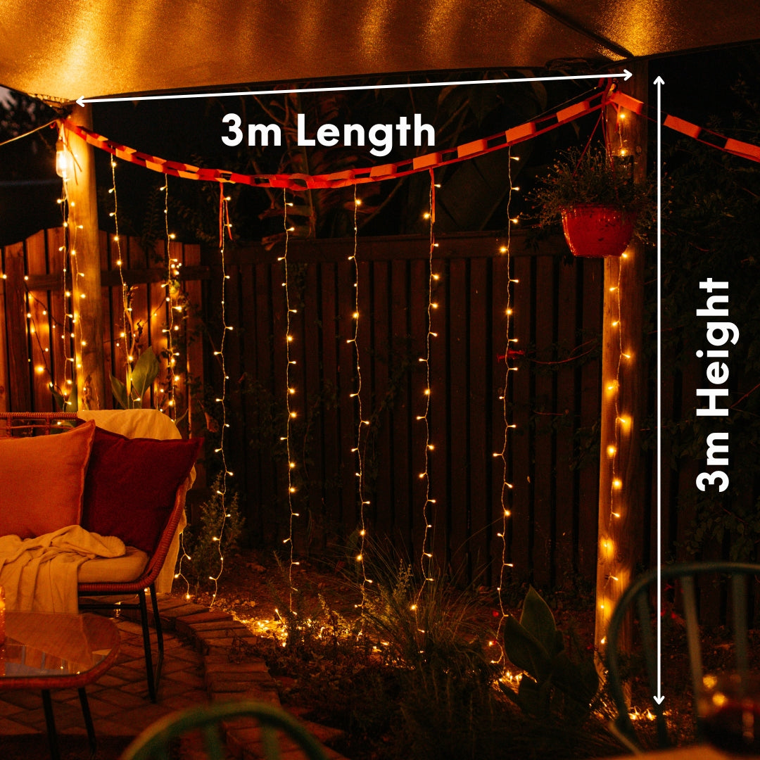 Outdoor setting with curtain fairy lights draped over a structure, labeled for length and height.