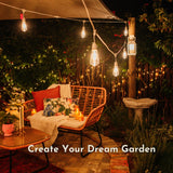 Garden setting with fairy lights, outdoor furniture, and decorative elements.