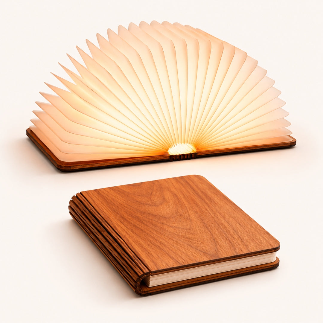 Foldable LED book light shown open and glowing and closed in walnut wood finish on white background