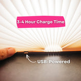 Close-up of foldable LED book light showing USB charging port with 3 to 4 hour charge time callout