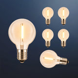 Six G40 globe LED replacement bulbs with E12 fitting and warm white filament glow on a dark navy background