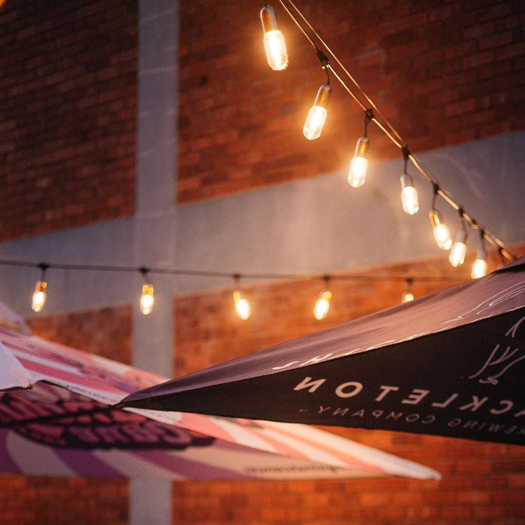 Stellar Gold String lights hanging above an event.