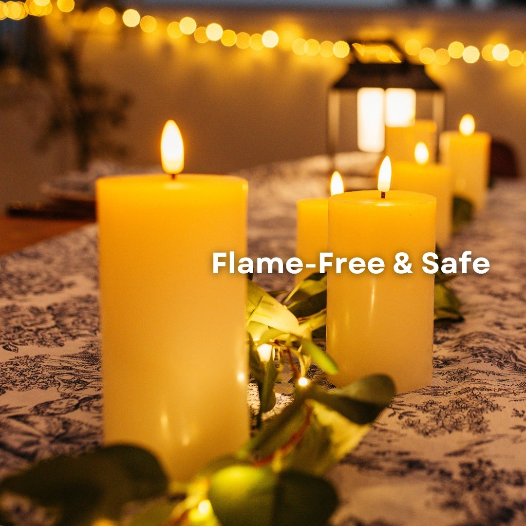 Ivory real wax flameless LED pillar candles as a dining table centrepiece with greenery garland and fairy lights with flame-free and safe callout