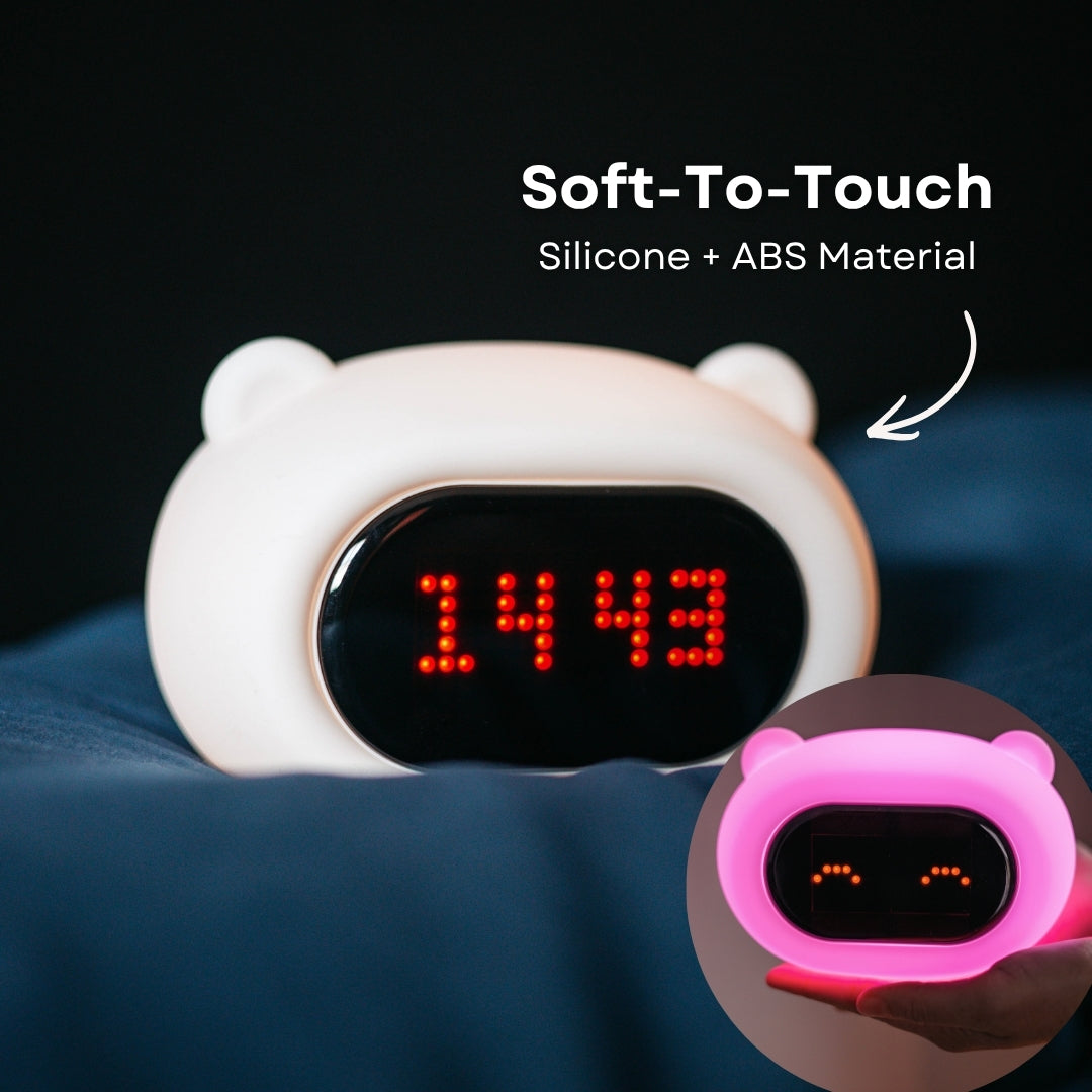 Hand touching the soft silicone surface of the Lightie Clock bear night light with soft to touch and silicone plus ABS material callout