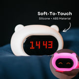 Hand touching the soft silicone surface of the Lightie Clock bear night light with soft to touch and silicone plus ABS material callout