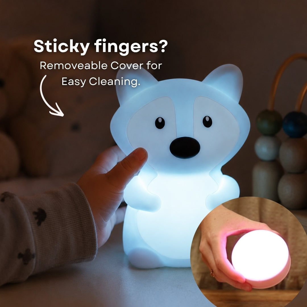 Child's hand touching the Lightie Fox night light glowing blue with sticky fingers and removable cover for easy cleaning callout and inset showing detached cover