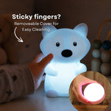 Child's hand touching the Lightie Fox night light glowing blue with sticky fingers and removable cover for easy cleaning callout and inset showing detached cover