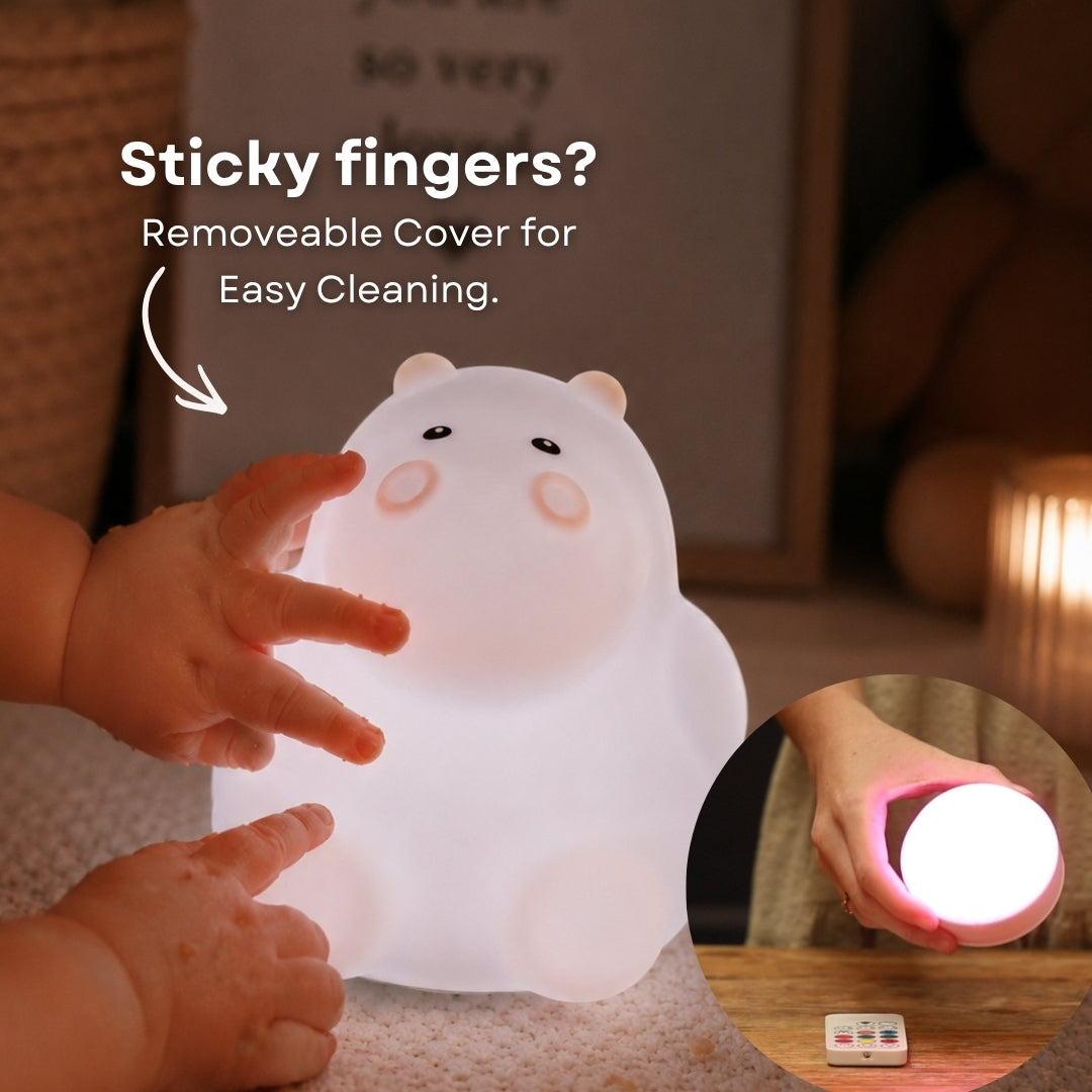 Child's hand touching the Lightie Hippo night light glowing blue with sticky fingers and removable cover for easy cleaning callout and inset showing detached cover