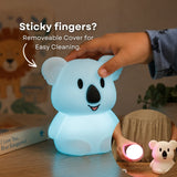 Child's hand touching the Lightie Koala night light glowing blue with sticky fingers and removable cover for easy cleaning callout and inset showing detached cover