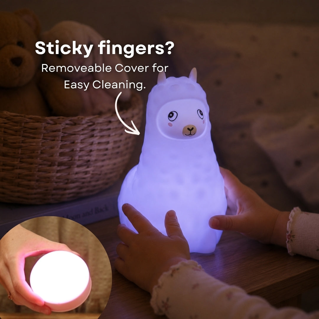 Child's hand touching the Lightie Llama night light glowing blue with sticky fingers and removable cover for easy cleaning callout and inset showing detached cover