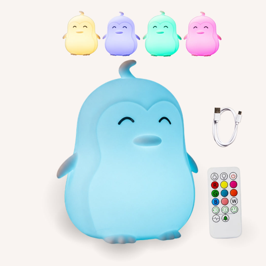 Lightie Penguin silicone night light shown in four colour modes including warm white, blue, pink, and purple with USB charging cable and remote control included