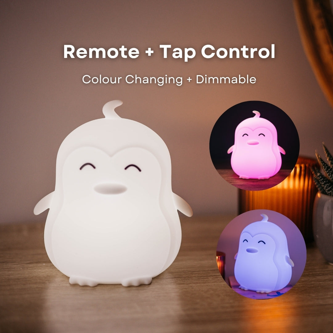Lightie Penguin night light glowing pink with remote and tap control and colour changing and dimmable callouts and insets showing orange and green colour modes