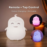 Lightie Penguin night light glowing pink with remote and tap control and colour changing and dimmable callouts and insets showing orange and green colour modes