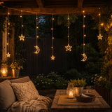 Moon and star curtain fairy lights displayed on a patio creating a soft warm ambience