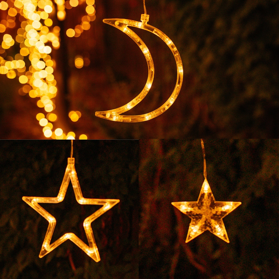 Close-up of all three warm white shaped LED pendants, large star, small star, and crescent moon