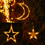 Close-up of all three warm white shaped LED pendants, large star, small star, and crescent moon