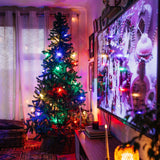 Multicolour Classic String Lights with colourful G40 globe bulbs strung across a Christmas Tree display creating a vibrant seasonal atmosphere