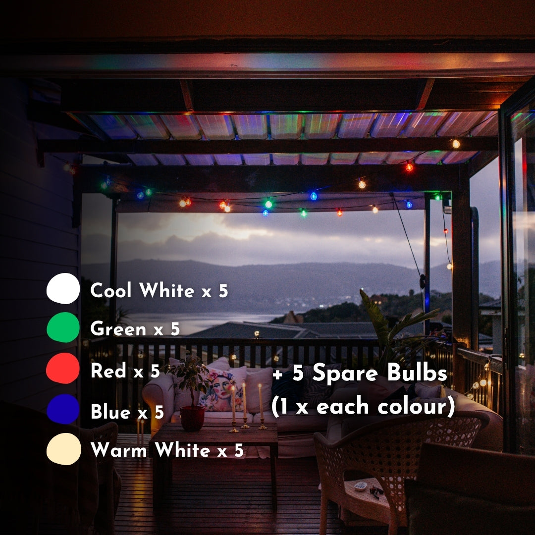Multicolour Classic String Lights with all five coloured G40 globe bulbs glowing vibrantly in a styled South African outdoor lifestyle setting at dusk