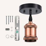 Copper pendant fitting cable with black ceiling rose, black braided cable, mounting bracket, screws, nuts, and washers laid out on a light background