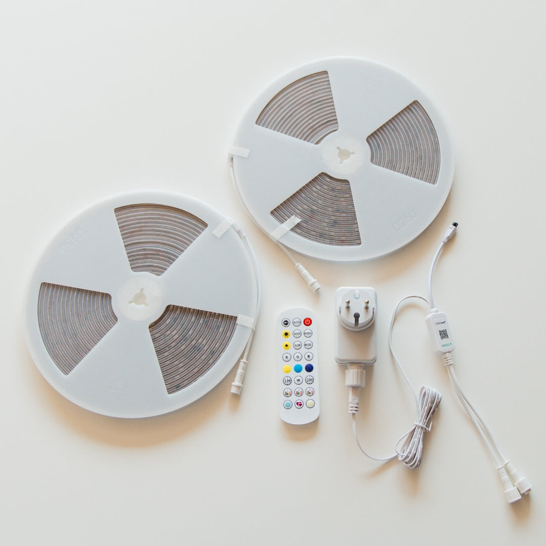Two 10m RGBIC LED strip light reels with remote control, plug and connector cables