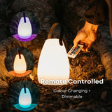 Person holding remote control for rechargeable RGB camping lantern with circles showing full range of available RGB colour modes