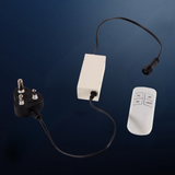 A white electronic control box with a black power cord featuring a SA three-pin plug and a black cable leading to a small white remote control, shown on a dark blue gradient background.