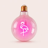 Single G125 globe LED bulb with pink flamingo filament detail and clear glass on a light background
