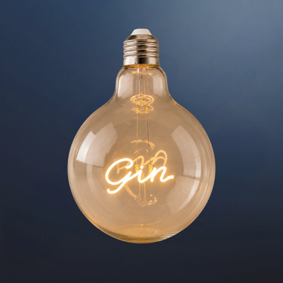 Single G125 globe LED bulb with GIN filament detail and clear glass on a dark navy background