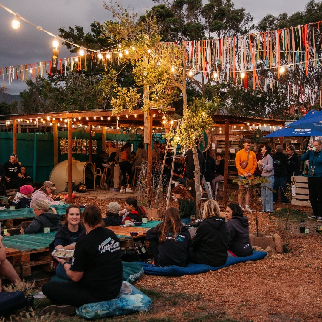 Retro White Festoon String Lights with warm white G45 globe bulbs strung across a South African outdoor space, Tears Sleepathon at dusk