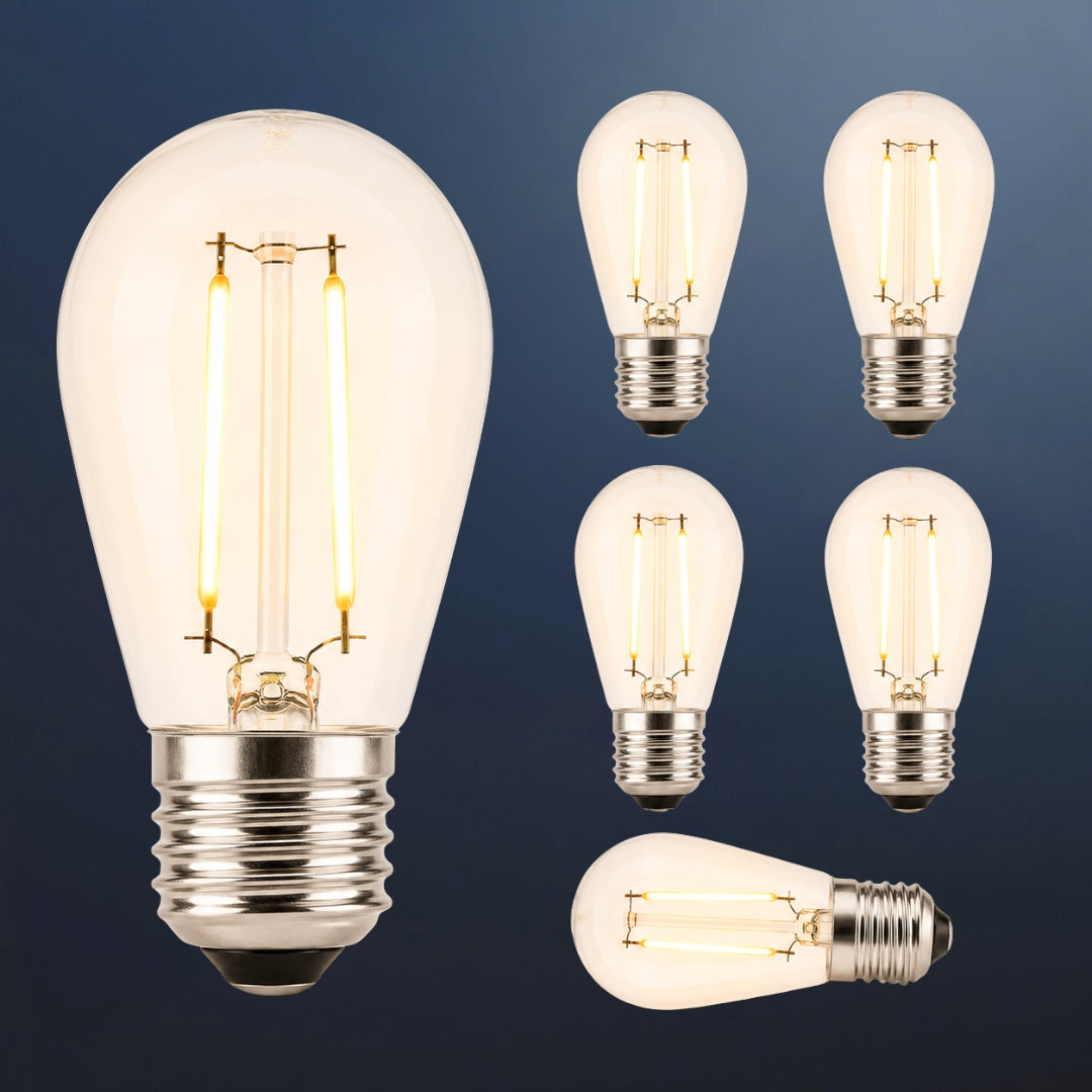 Six S14 vintage LED festoon bulbs with E27 fitting and warm amber filament glow on a dark navy background