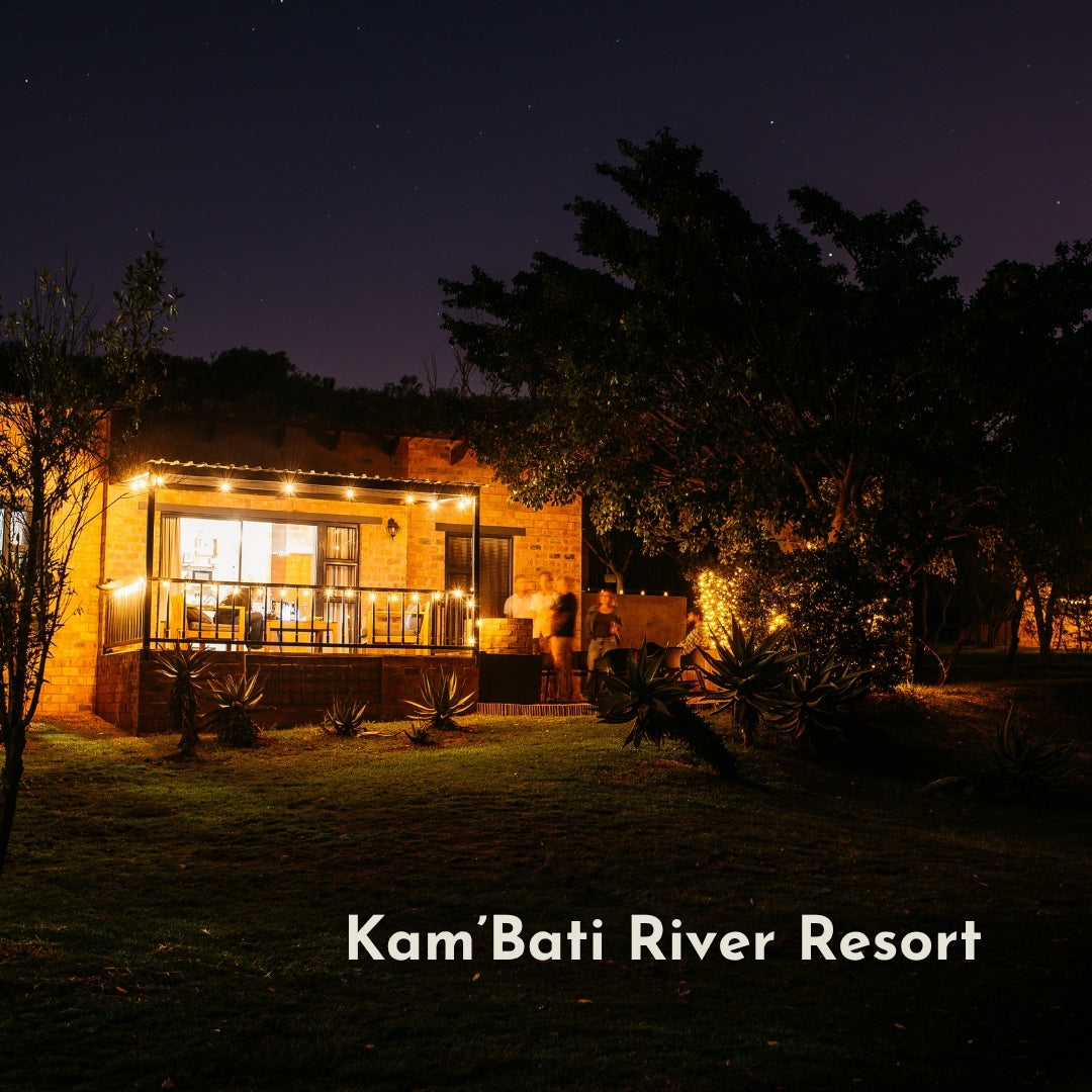 Solar Classic String Lights with warm white G40 globe bulbs strung across the veranda patio at Kam'Bati River Resort creating a warm golden glow at dusk