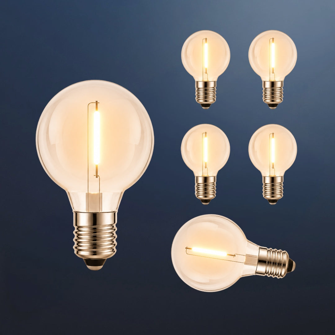 Six solar G40 globe LED replacement bulbs with E12 fitting and warm white filament glow on a dark navy background